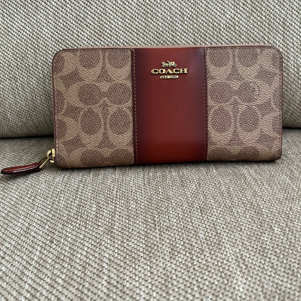 Authentic preowned Coach signature accordion large wallet.